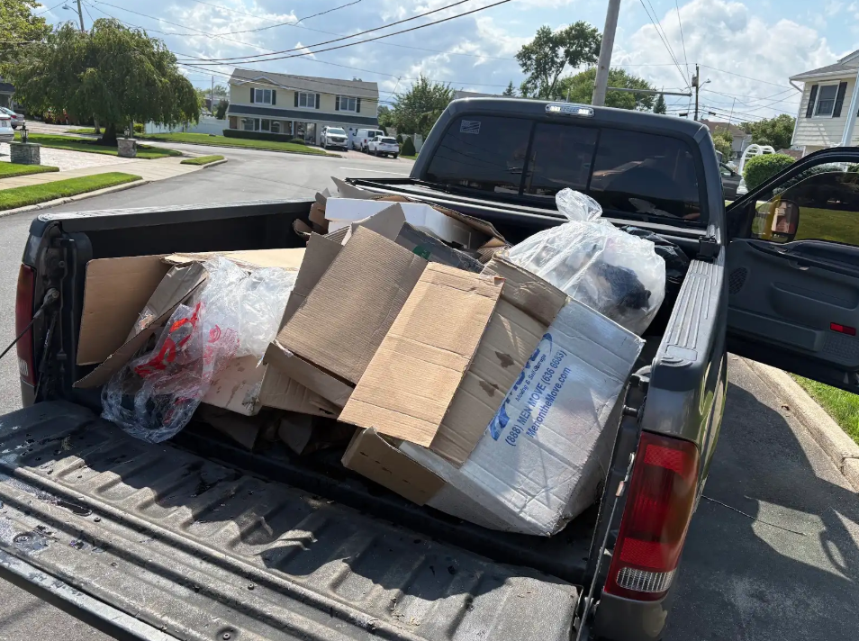 trash pickup in truck islip